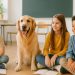 A friendly calm dog sitting with schoolchildren in a bright classroom